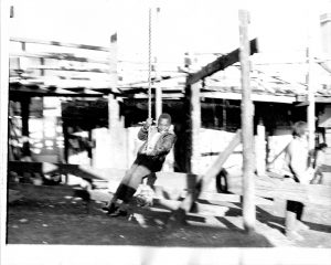 Where is the Gaiety? Still Images. Notting Hill Gate. Inside the Adventure Playground. 1973. Child on rope swing looking to camera 1. Deposited with MayDay Rooms by Wilf Thust. December, 2013.