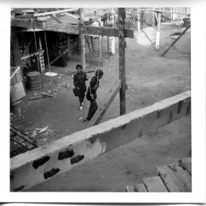 Where is the Gaiety? Still Images. Notting Hill Gate. Inside the Adventure Playground. 1973. Children holding swing ropes 3. Deposited with MayDay Rooms by Wilf Thust. December, 2013.