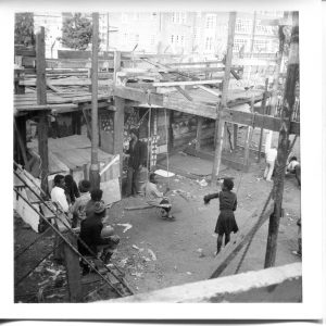 Where is the Gaiety? Still Images. Notting Hill Gate. Inside the Adventure Playground. 1973. Children sitting on swing ropes 2. Deposited with MayDay Rooms by Wilf Thust. December, 2013.