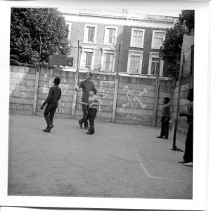 Where is the Gaiety? Still Images. Notting Hill Gate. Inside the Adventure Playground. 1973. Play ‘leader’ with children 4. ‘Help old people’. Deposited with MayDay Rooms by Wilf Thust. December, 2013.